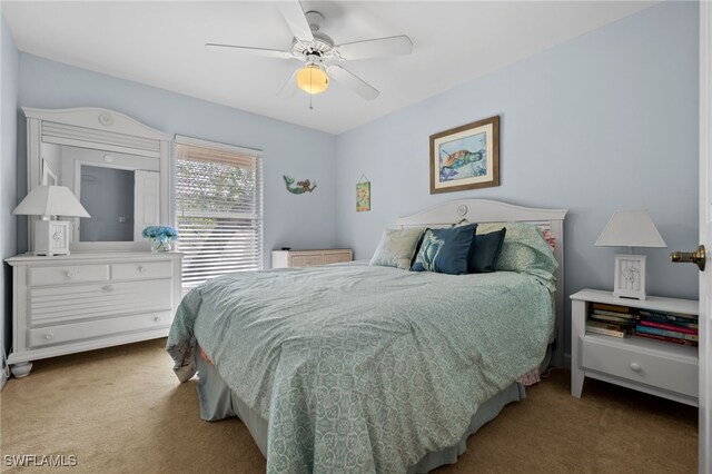 8073 Panther Trl Unit 1403, Naples, FL 34113 - bedroom with a ceiling fan and carpet