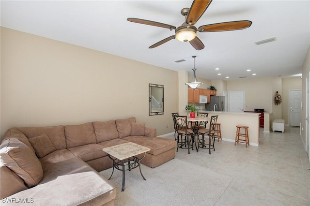 15703 Marcello Cir, Naples, FL 34110 - living room featuring recessed lighting, visible vents, baseboards, and a ceiling fan