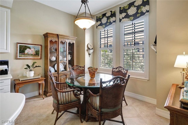 96 Vivante Blvd Unit 211, Punta Gorda, FL 33950 - dining area with light tile patterned floors and baseboards