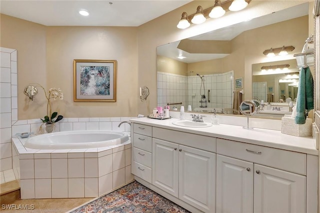96 Vivante Blvd Unit 211, Punta Gorda, FL 33950 - bathroom with a garden tub, vanity, a tile shower, and tile patterned floors