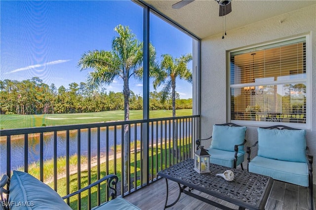 10329 Heritage Bay Blvd Unit 1622, Naples, FL 34120 - sunroom with a ceiling fan, a water view, and view of wooded area
