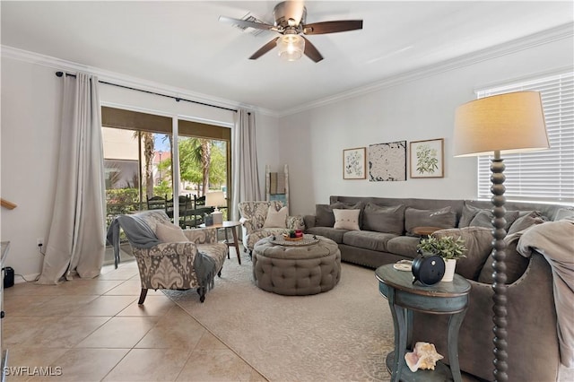 living area featuring ornamental molding, a ceiling fan, and light tile patterned floors