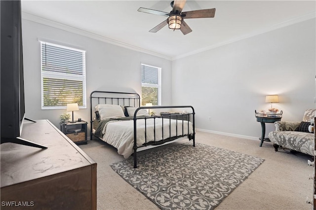 bedroom with baseboards, ornamental molding, ceiling fan, and carpet