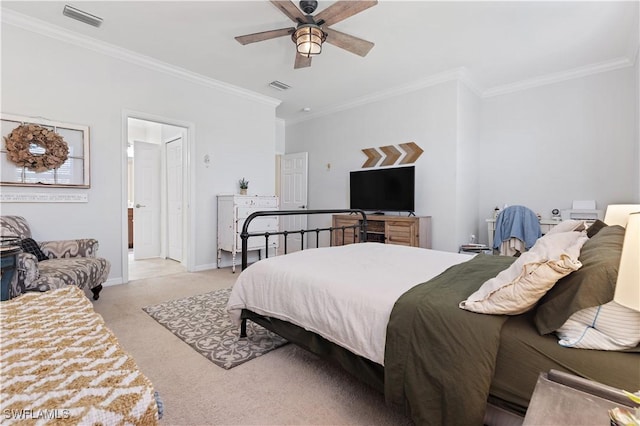 bedroom with baseboards, ornamental molding, visible vents, and light colored carpet