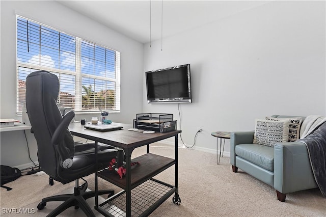 office featuring light carpet and baseboards