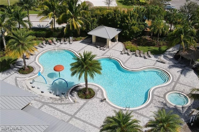 pool with a patio and a gazebo