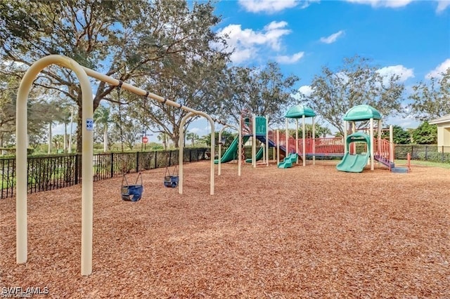 community jungle gym featuring fence
