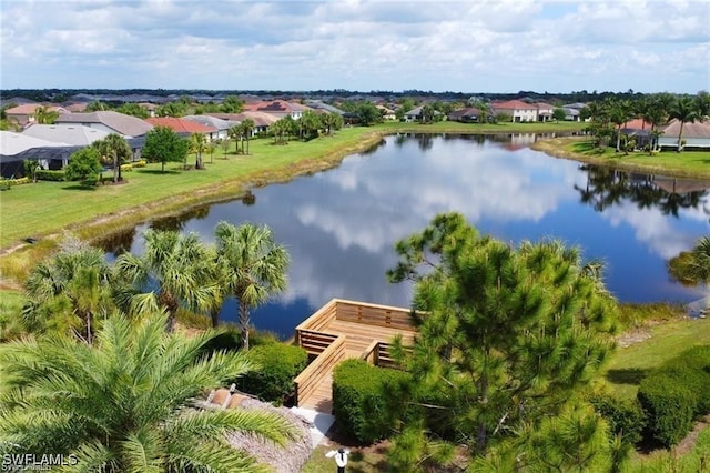 bird's eye view with a water view and a residential view