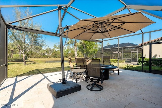 view of patio / terrace featuring outdoor dining area and a lanai