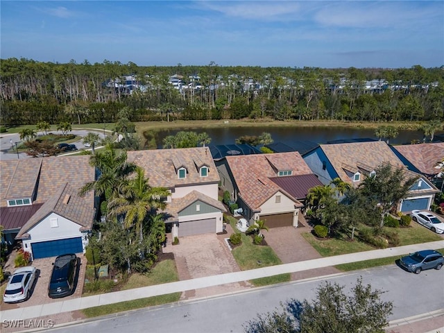 aerial view featuring a residential view and a water view