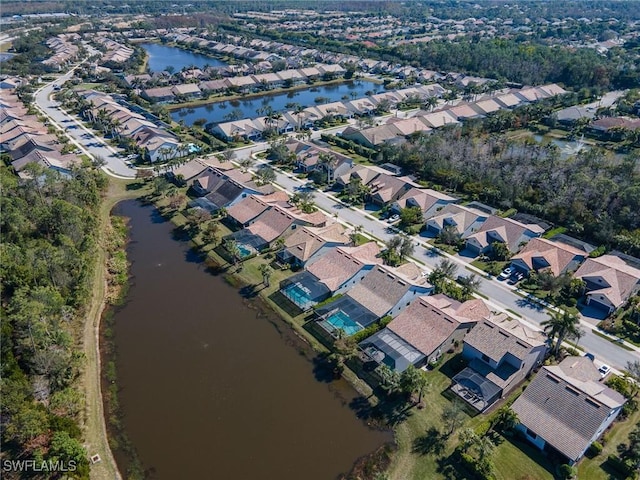 bird's eye view featuring a residential view and a water view