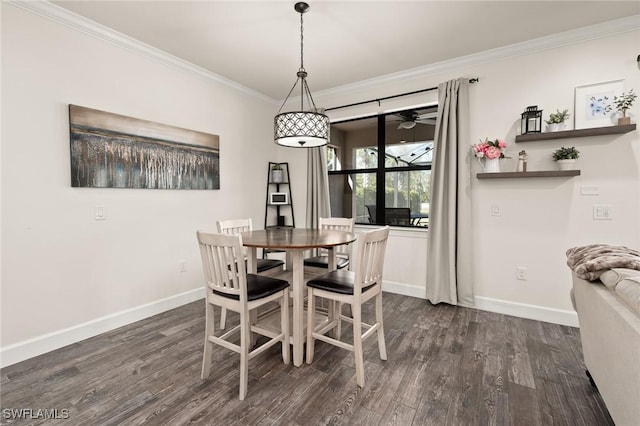 dining area with baseboards, dark wood-style flooring, and ornamental molding