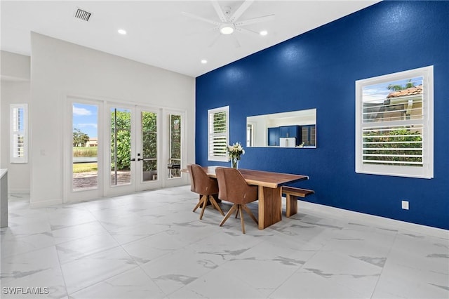 2160 Vardin Pl, Naples, FL 34120 - dining area with french doors, a high ceiling, marble finish flooring, recessed lighting, and baseboards