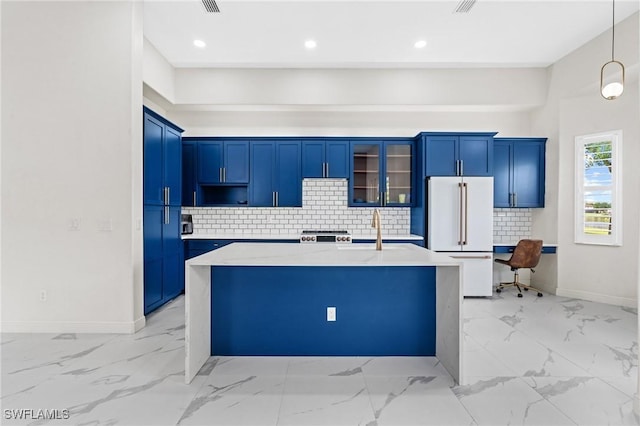 2160 Vardin Pl, Naples, FL 34120 - kitchen featuring freestanding refrigerator, light marble finish floors, baseboards, a kitchen island with sink, and recessed lighting