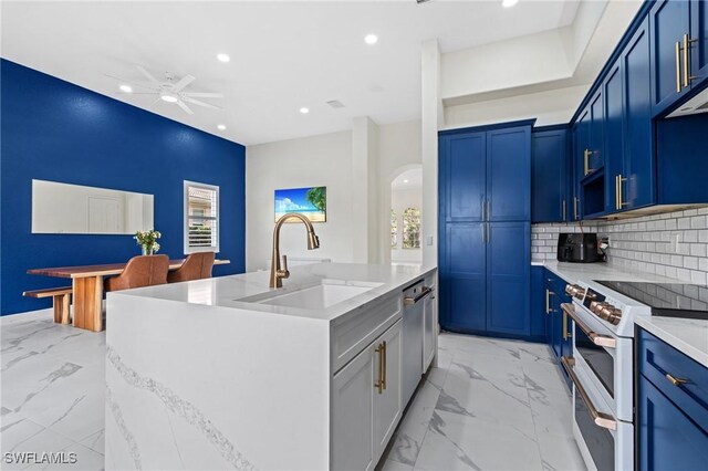 2160 Vardin Pl, Naples, FL 34120 - kitchen with a sink, white range oven, arched walkways, a ceiling fan, and light marble finish flooring