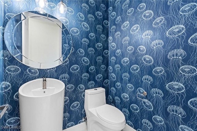 2160 Vardin Pl, Naples, FL 34120 - bathroom with wallpapered walls and toilet