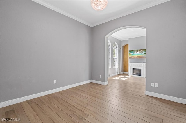2160 Vardin Pl, Naples, FL 34120 - unfurnished room featuring ornamental molding, baseboards, wood finished floors, and a fireplace