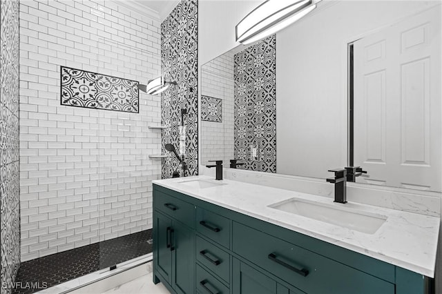 2160 Vardin Pl, Naples, FL 34120 - bathroom featuring double vanity, crown molding, and a tile shower