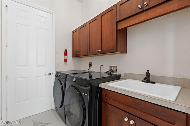 2160 Vardin Pl, Naples, FL 34120 - laundry room featuring washing machine and dryer, light marble finish floors, and cabinet space