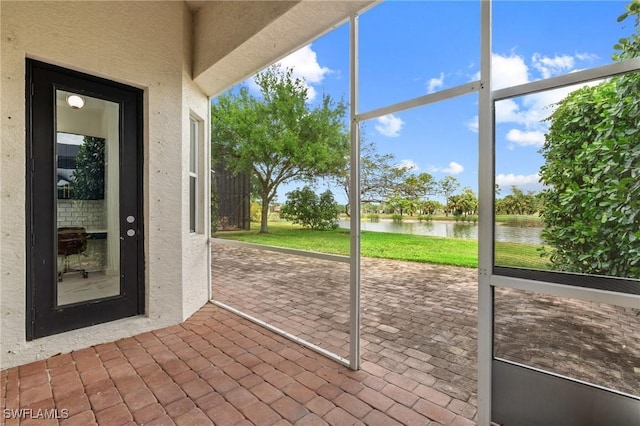2160 Vardin Pl, Naples, FL 34120 - unfurnished sunroom with a water view