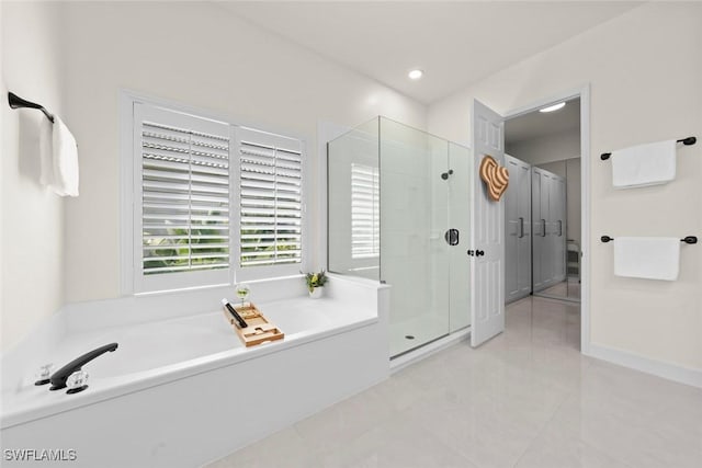 9119 Links Dr, Fort Myers, FL 33913 - full bath with tile patterned floors, recessed lighting, a stall shower, and a bath