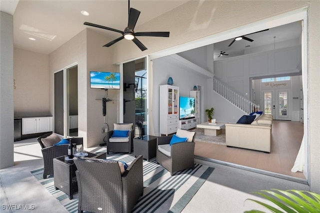 9119 Links Dr, Fort Myers, FL 33913 - view of patio featuring an outdoor living space, stairway, and a ceiling fan