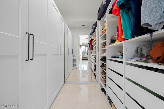 9119 Links Dr, Fort Myers, FL 33913 - spacious closet featuring light tile patterned floors