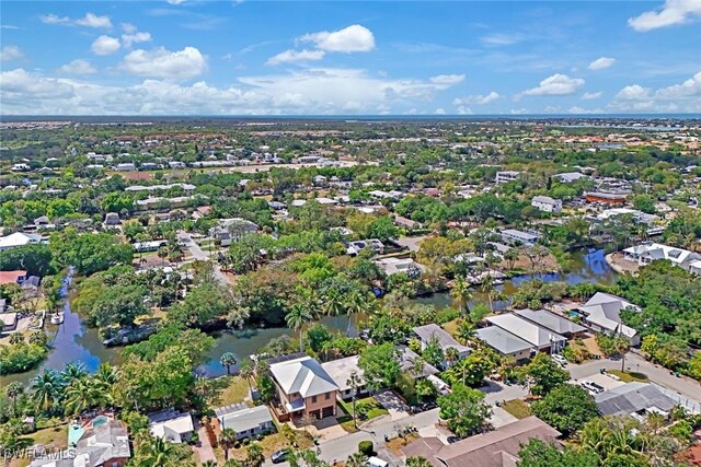 birds eye view of property featuring a water view and a residential view
