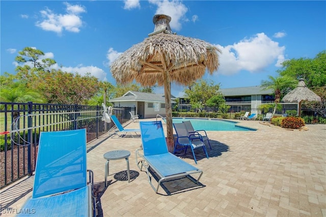 1232 Commonwealth Cir Unit P103, Naples, FL 34116 - pool featuring a patio and fence
