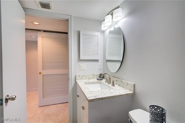 1232 Commonwealth Cir Unit P103, Naples, FL 34116 - half bath featuring visible vents, toilet, vanity, and tile patterned flooring