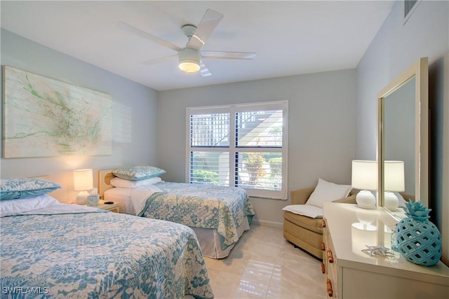 1232 Commonwealth Cir Unit P103, Naples, FL 34116 - bedroom with light tile patterned floors, baseboards, and a ceiling fan