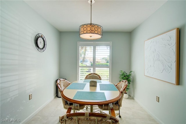 1232 Commonwealth Cir Unit P103, Naples, FL 34116 - dining area with light tile patterned floors and baseboards