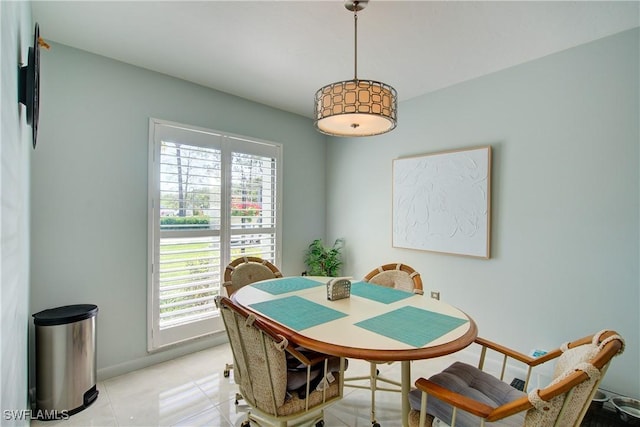 1232 Commonwealth Cir Unit P103, Naples, FL 34116 - dining area featuring baseboards, plenty of natural light, and light tile patterned flooring