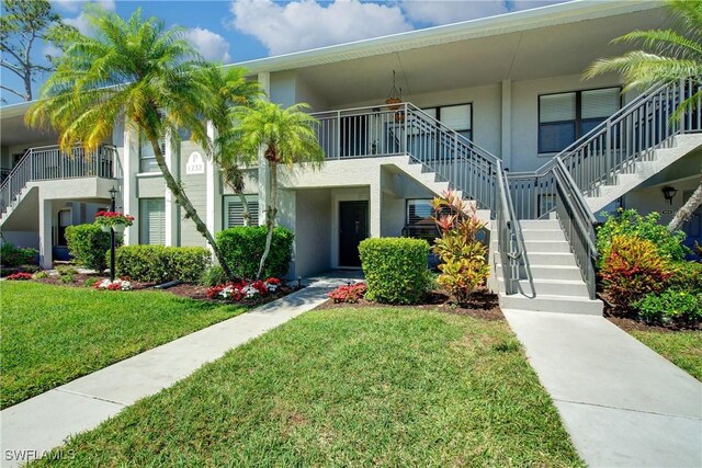 1232 Commonwealth Cir Unit P103, Naples, FL 34116 - view of building exterior featuring stairway