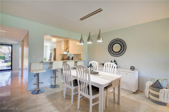 1232 Commonwealth Cir Unit P103, Naples, FL 34116 - dining room with baseboards