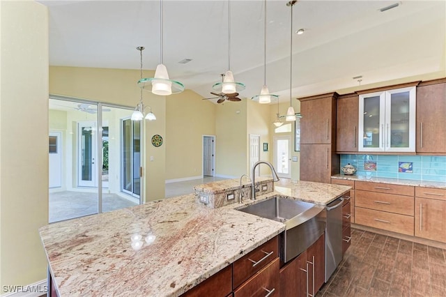 1368 Grebe Dr, Punta Gorda, FL 33950 - kitchen featuring visible vents, a sink, glass insert cabinets, dishwasher, and tasteful backsplash