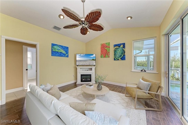 1368 Grebe Dr, Punta Gorda, FL 33950 - living area with visible vents, wood finished floors, baseboards, and vaulted ceiling