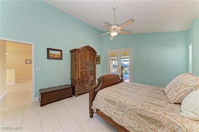 1368 Grebe Dr, Punta Gorda, FL 33950 - bedroom featuring access to exterior, baseboards, ceiling fan, vaulted ceiling, and light tile patterned floors