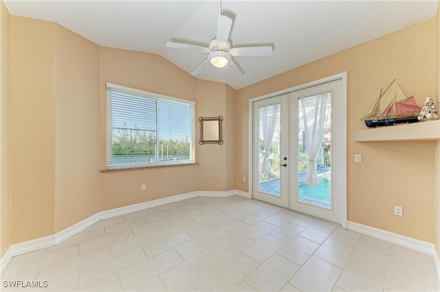 1368 Grebe Dr, Punta Gorda, FL 33950 - empty room featuring baseboards, lofted ceiling, french doors, tile patterned floors, and a ceiling fan