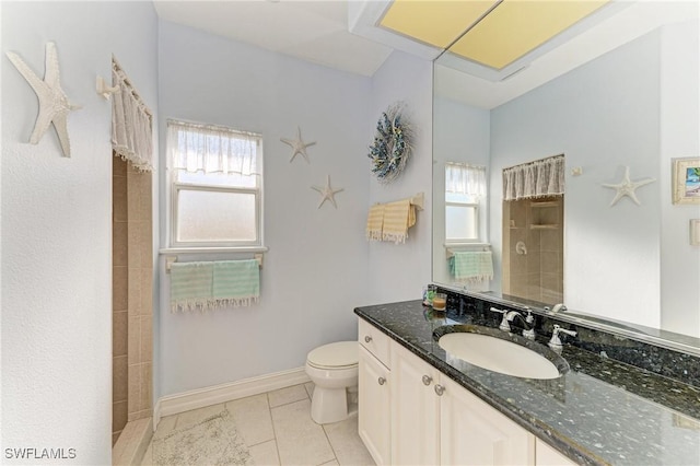 1368 Grebe Dr, Punta Gorda, FL 33950 - bathroom with vanity, baseboards, tiled shower, tile patterned floors, and toilet