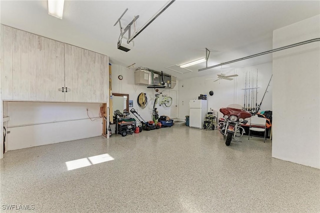 1368 Grebe Dr, Punta Gorda, FL 33950 - garage featuring a garage door opener and freestanding refrigerator