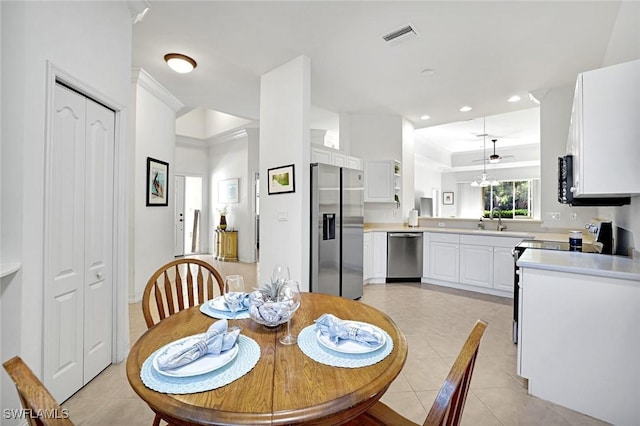 8120 Sanctuary Dr Unit 1, Naples, FL 34104 - dining room featuring light tile patterned floors, crown molding, recessed lighting, and baseboards