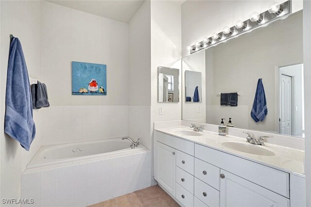 8120 Sanctuary Dr Unit 1, Naples, FL 34104 - full bathroom featuring double vanity, a garden tub, and tile patterned floors