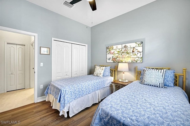 8120 Sanctuary Dr Unit 1, Naples, FL 34104 - bedroom featuring wood finished floors, a ceiling fan, baseboards, a high ceiling, and a closet