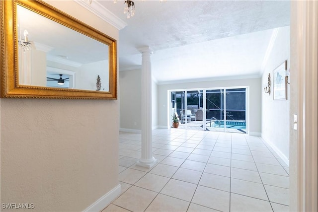 209 Pinehurst Cir, Naples, FL 34113 - hall featuring ornate columns, light tile patterned floors, baseboards, and crown molding