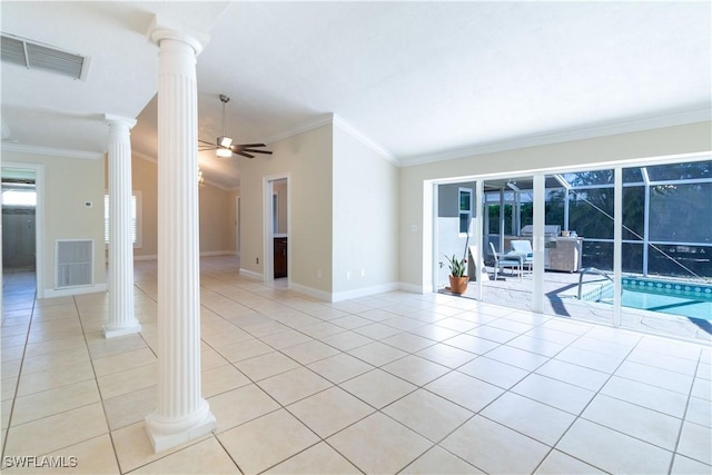 209 Pinehurst Cir, Naples, FL 34113 - empty room with light tile patterned flooring, visible vents, crown molding, a ceiling fan, and decorative columns
