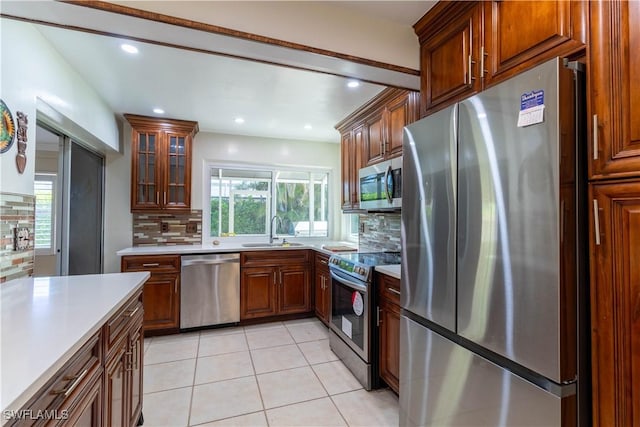 209 Pinehurst Cir, Naples, FL 34113 - kitchen with light countertops, a sink, plenty of natural light, and appliances with stainless steel finishes