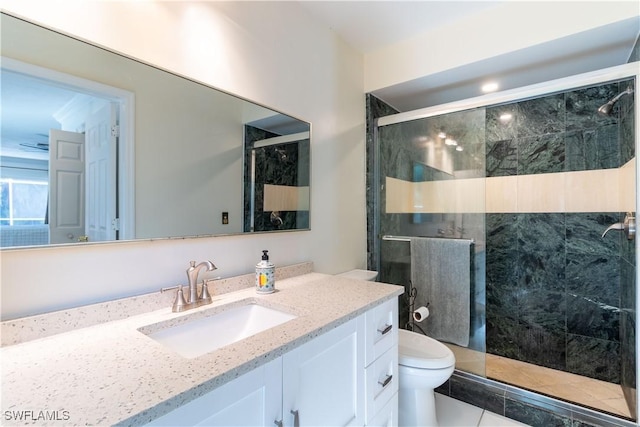 209 Pinehurst Cir, Naples, FL 34113 - full bathroom featuring a shower stall, toilet, and vanity