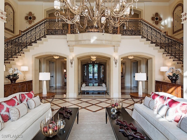 5051 Pelican Colony Blvd Unit 301, Bonita Springs, FL 34134 - living room with stairs, arched walkways, and ornamental molding