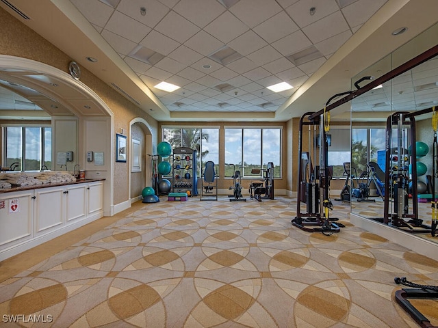 5051 Pelican Colony Blvd Unit 301, Bonita Springs, FL 34134 - gym with a tray ceiling, visible vents, and a healthy amount of sunlight